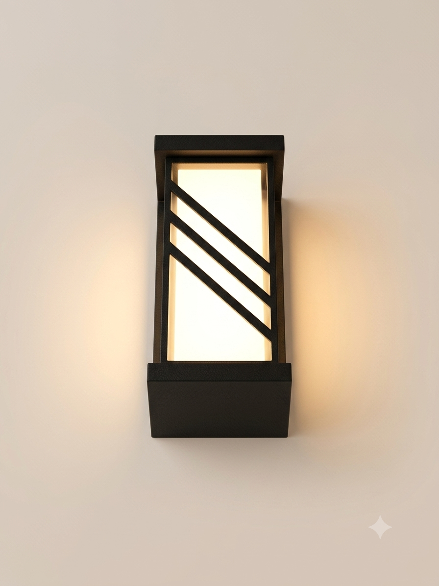 A rectangular black wall sconce with a modern geometric design, featuring slanted metal lines that cut across its illuminated face to provide warm and attractive lighting.