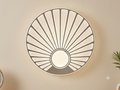 A circular wall light unit with an elegant design inspired by the shape of a seashell, featuring radial lines and illuminated panels with a shimmering effect.