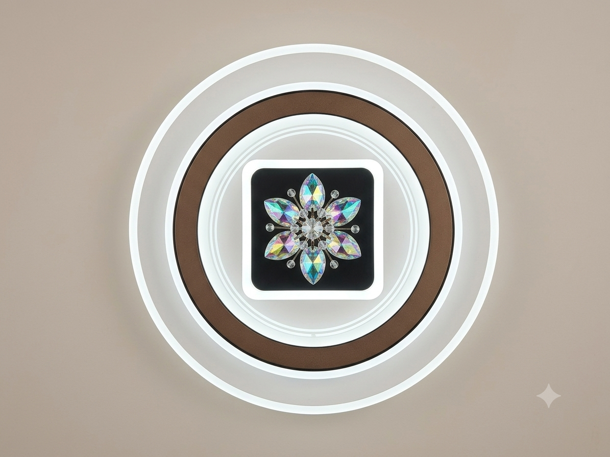 A modern ceiling light unit that combines simple circular light rings with a central design adorned with iridescent crystals forming a sparkling geometric star or flower.