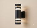 A black cylindrical wall sconce with a modern design, equipped with transparent rings to distribute light from above and below.