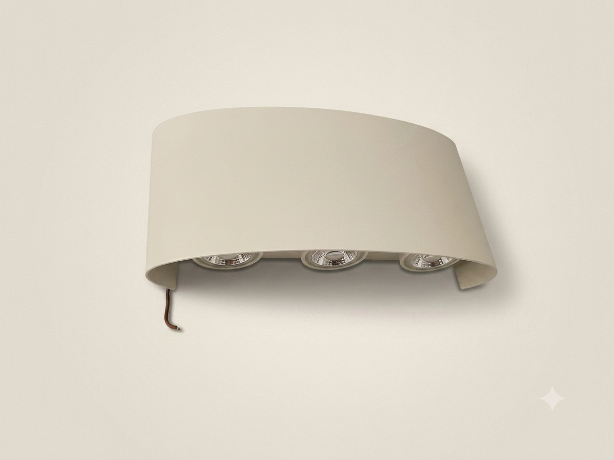 A gold wall sconce with an elegant curved metal design featuring three spherical bulbs that distribute light upwards.