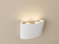 A white wall sconce with a simple and elegant curved design, providing soft overhead lighting.