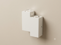 White wall sconce with a stepped cube design and prominent spherical glass lenses.
