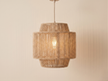 A rustic chandelier made from natural jute threads.
