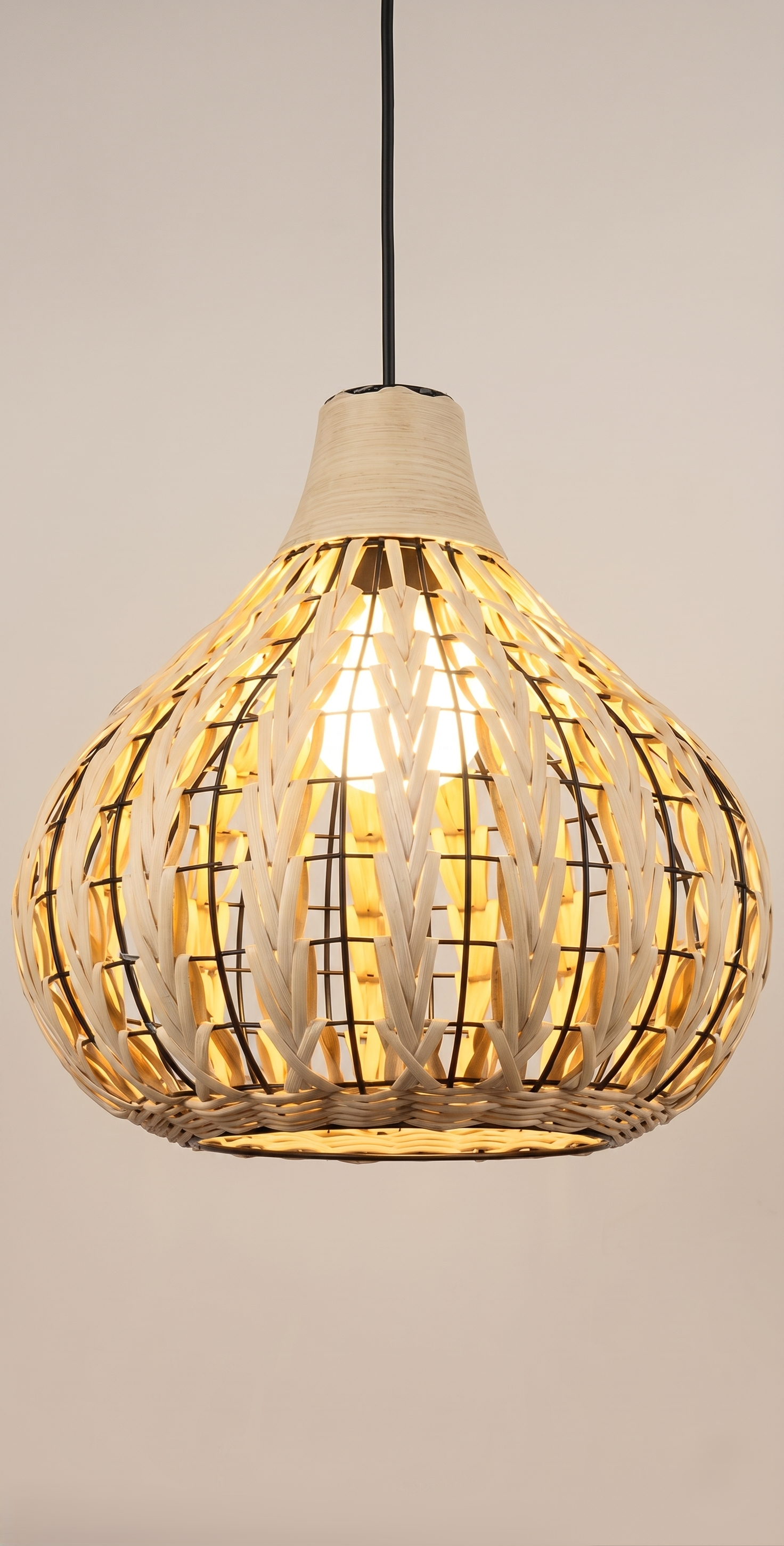 A "bohemian" style pendant light unit based on a metal frame covered with woven bamboo.