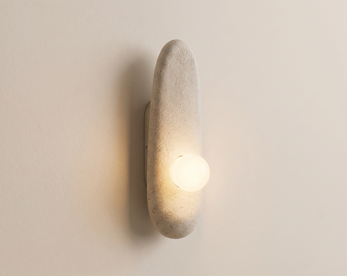 Modern wall lamp (sconcealer) with a natural stone design.