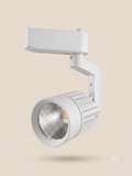 A modern white track light with a practical and ergonomic design.