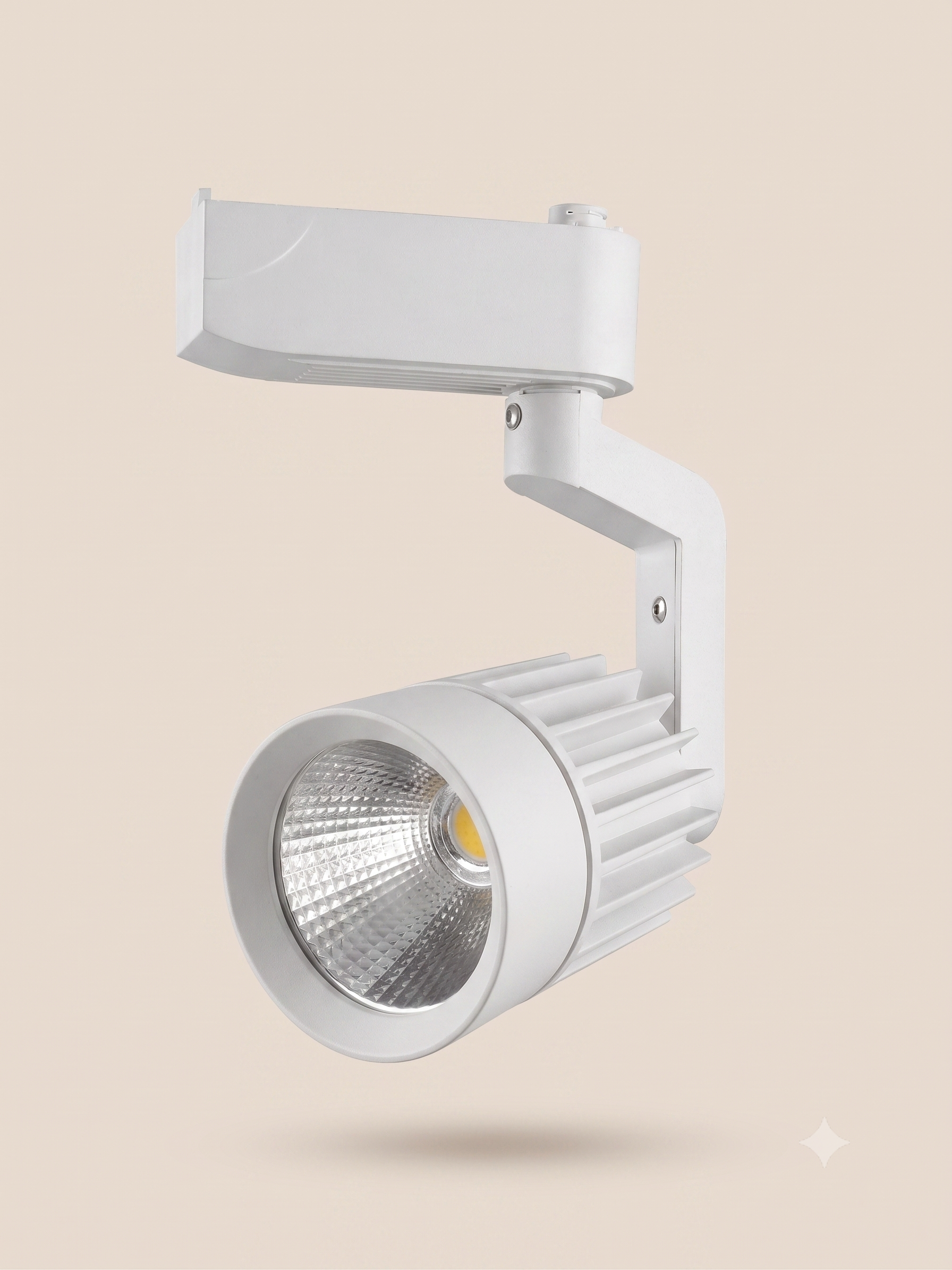 A modern white track light with a practical and ergonomic design.