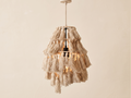 Bohemian chandelier (hanging lamp) with macrame tassels.