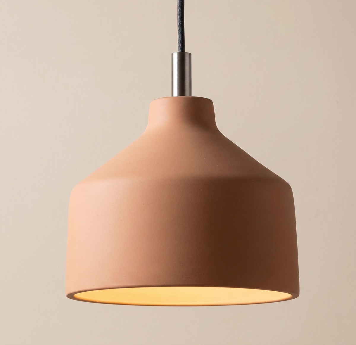 The "terracotta bell" or "terracotta cone" lamp.