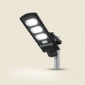 Pole-mounted solar LED street light with 3 panels and motion sensor