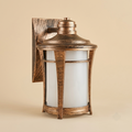 Seated figure lamp with cracked eggshell head and bulb cluster