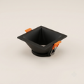 Square black recessed spotlight trim with pyramidal reflector